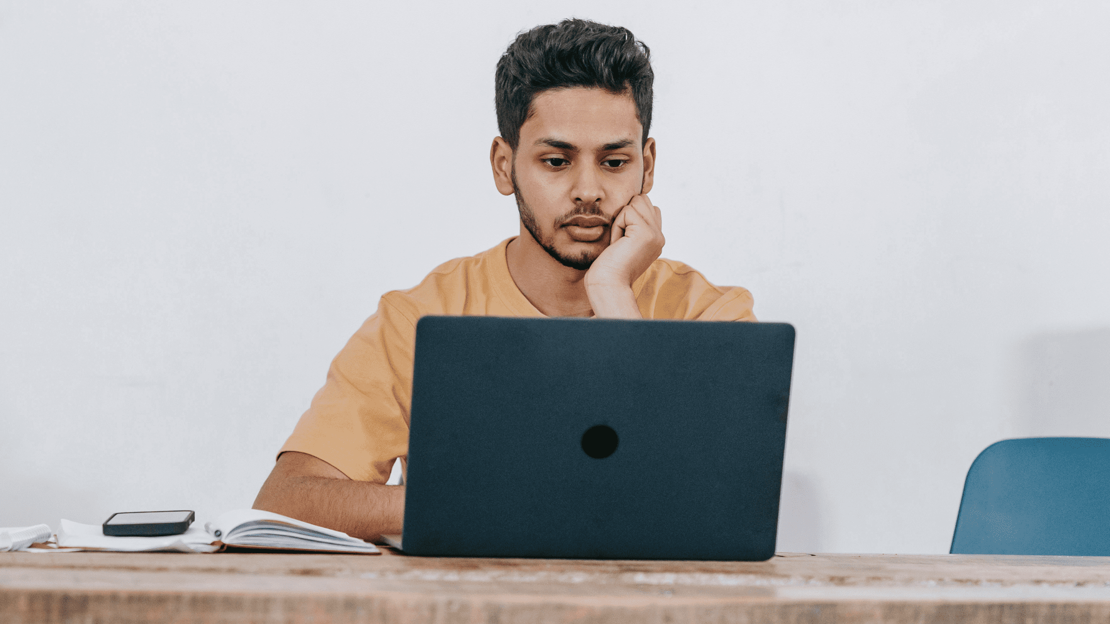 Student using laptop while studying for COMLEX level 1.